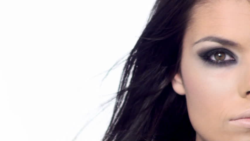 Young beautiful brunette with black scary makeup 