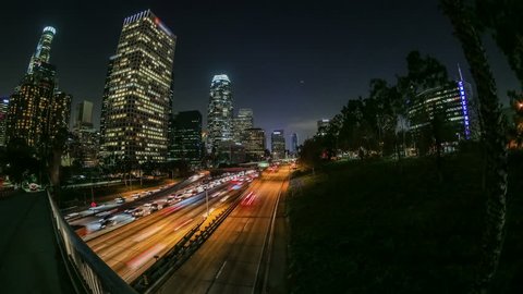 City traffic panning time lapse in downtown Los Angeles at night.