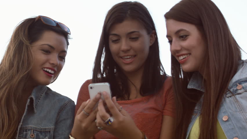 Teen Girls Amused By Something They See On A Cell Phone Royalty-Free Stock Footage #5290091