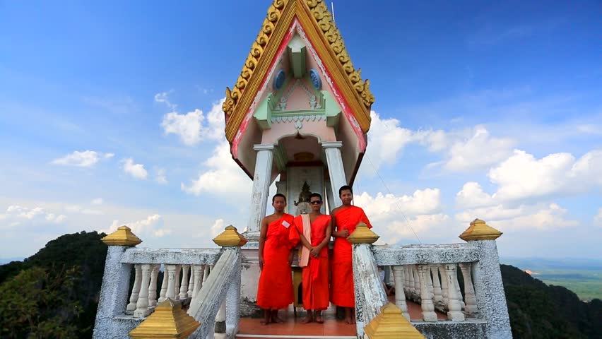 KRABI - CIRCA DECEMBER: Three young buddhist monks at Wat Tham Seua (Tiger Cave)