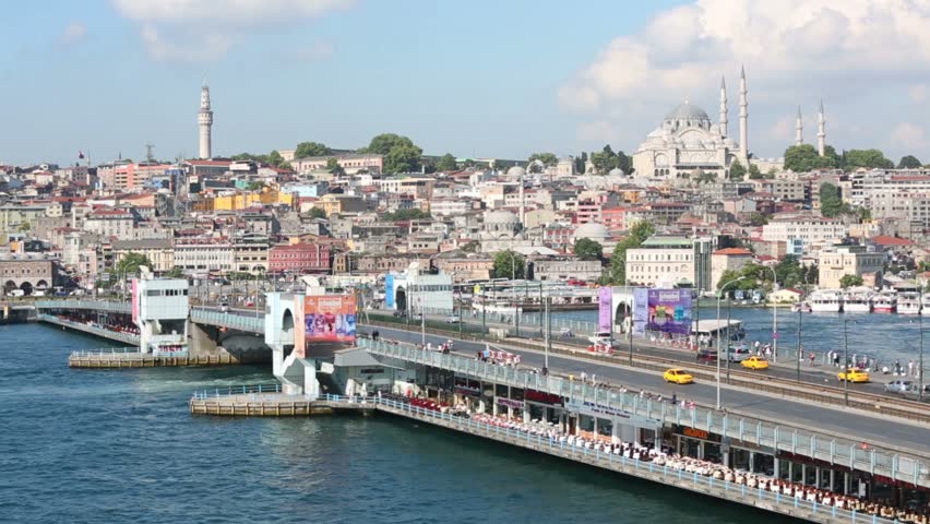 ISTANBUL - JUL 3: Cars driving over Galata Bridge and restaurants under bridge on July 3, 2012 in Istanbul, Turkey. Is bridge that spans Golden Horn in Istanbul.