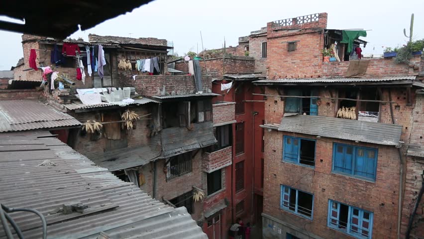 A top view of the windows and residential houses in a poor neighborhood,