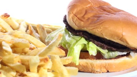 Burger and fries on plate - HD LOOP