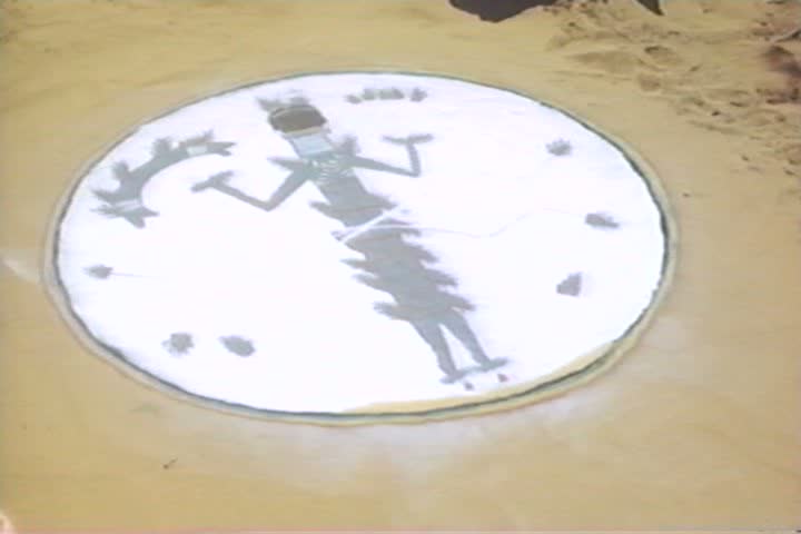 American Indian tribal leaders make a sand painting in the 1930s.