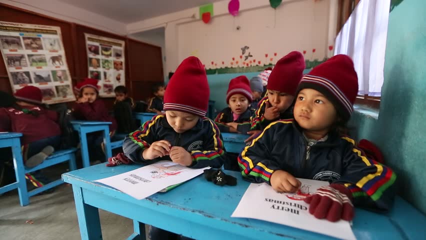 KATHMANDU, NEPAL - DEC 24: Unknown pupils in English class during the
