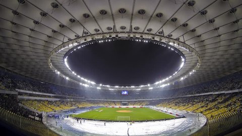KYIV, UKRAINE - DECEMBER 12: Panoramic view of Olympic stadium during UEFA Europa League game between FC Dynamo Kyiv and Rapid Wien on December 12, 2013 in Kyiv, Ukraine (Time Lapse)
