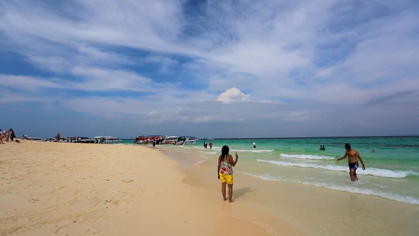 BAMBOO ISLAND, THAILAND - CIRCA DECEMBER: People on a beach, on circa December,