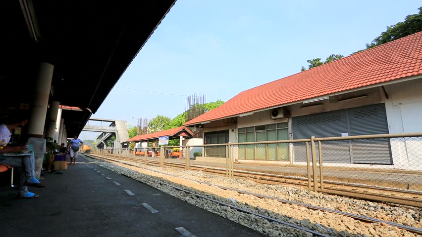 BANGKOK, THAILAND - CIRCA DECEMBER: Train passe Sam Sen Railway Station, on