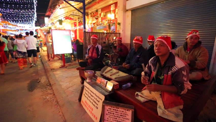 SIEM REAP, CAMBODIA - CIRCA DECEMBER: Pub Street, local musicians with