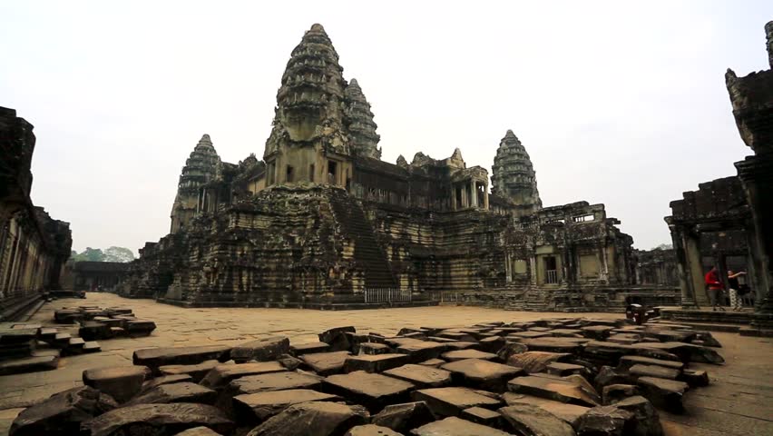 ANGKOR, CAMBODIA - CIRCA DECEMBER: Young man and woman visit Angkor Wat Temple,