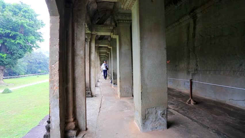 ANGKOR, CAMBODIA - CIRCA DECEMBER: Tourists visit Angkor Wat Temple, on circa