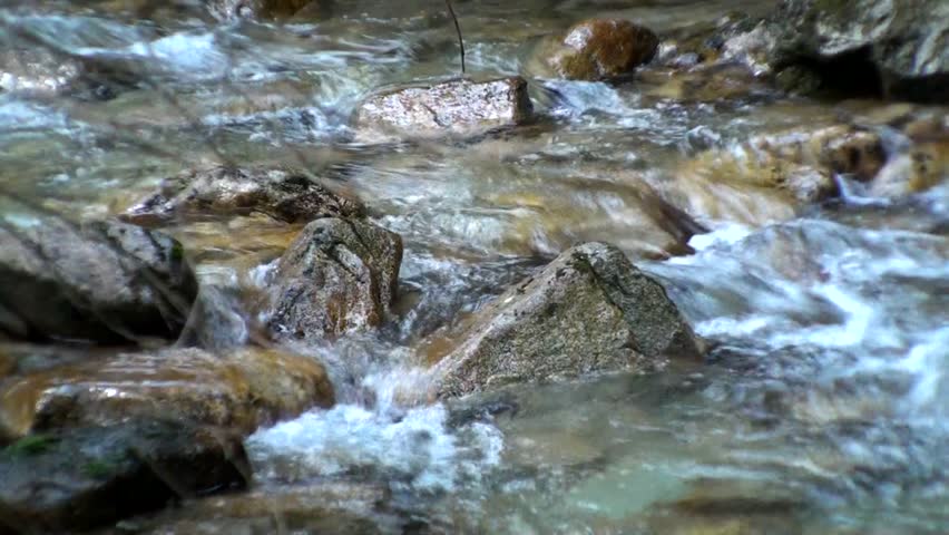 Small mountain stream with rocks 