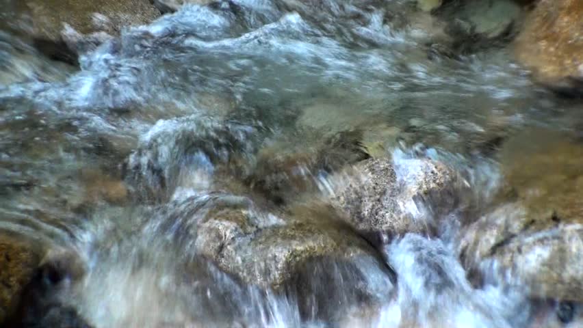 Small mountain stream with rocks 