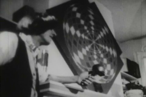 Black and white footage of hippy concerts, drum circles, and lifestyle during the 1970s