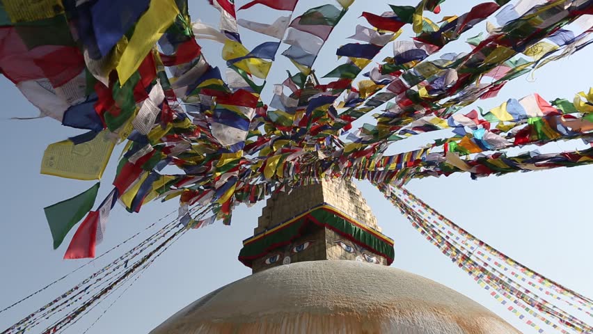 Colored flags fly on the stupa Boudhanath in Kathmandu, Nepal.
