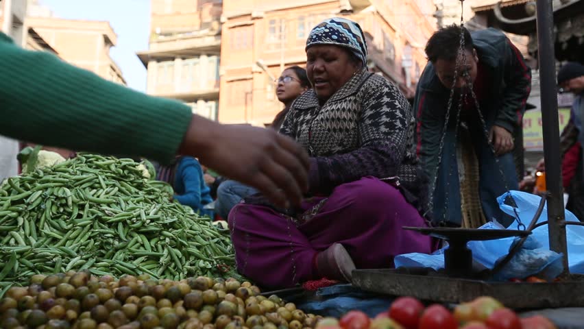 KATHMANDU, NEPAL - DEC 23: Unidentified street vendor in historic center of