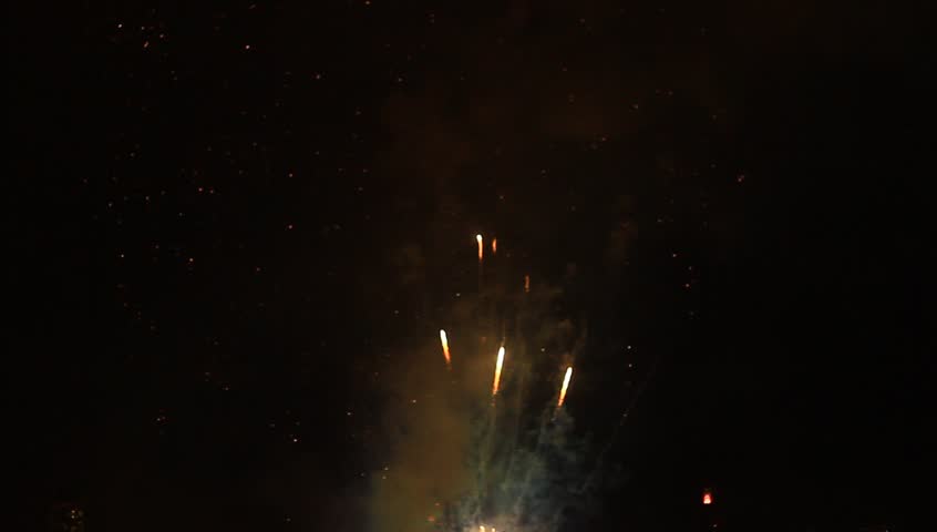 Colorful fireworks at holiday night. Amazing fireworks, full of fire and smoke.
