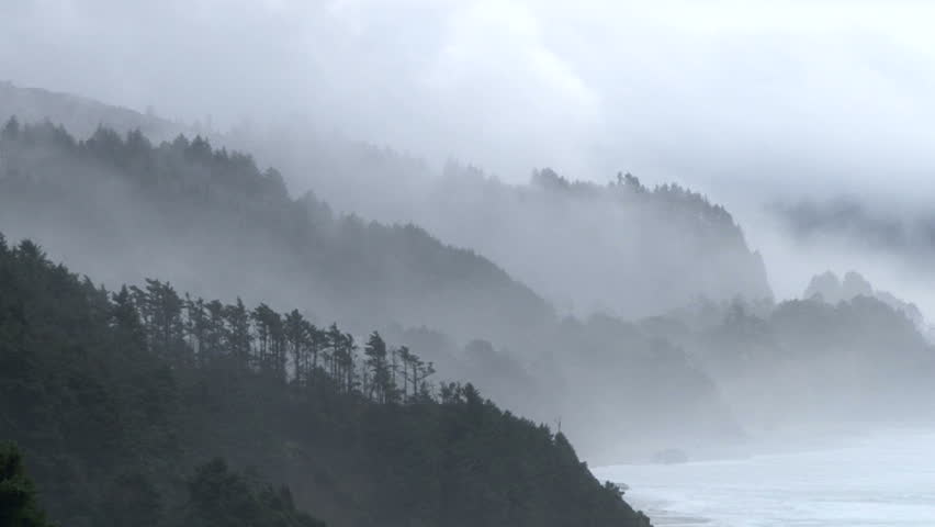 Storm brings rain and fog to the Pacific Northwest coast in Oregon, camera zoom