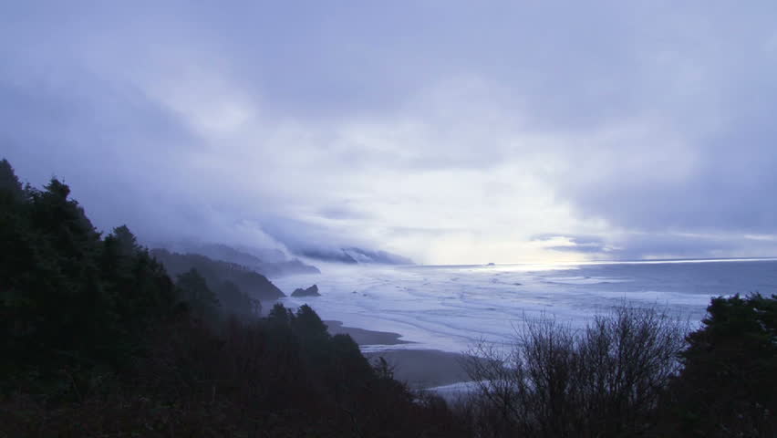 Stormy weather brings rain and fog to the Pacific Northwest shore in Oregon.