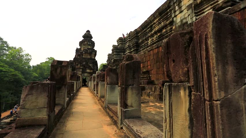 ANGKOR, CAMBODIA - CIRCA DECEMBER: Tourists visit Baphuon temple, on circa
