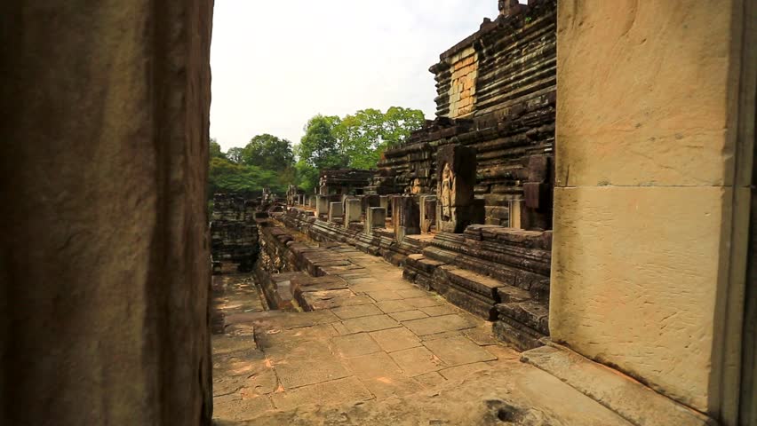 ANGKOR, CAMBODIA - CIRCA DECEMBER: Tourists visit Baphuon temple, on circa