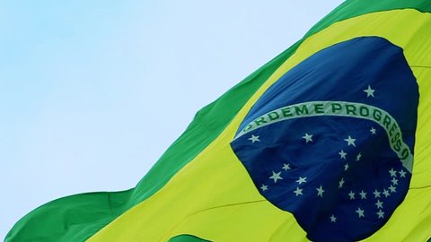 Real Brazil flag waving in the wind in slow motion. The Brazilian flag is a national symbol of Brasil. In portuguese (brazilian language) we call it "Bandeira do Brasil".