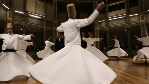 ISTANBUL, TURKEY - DECEMBER 17: Sufi whirling dervish (Semazen) dances on December 17, 2013 in Istanbul, Turkey. 