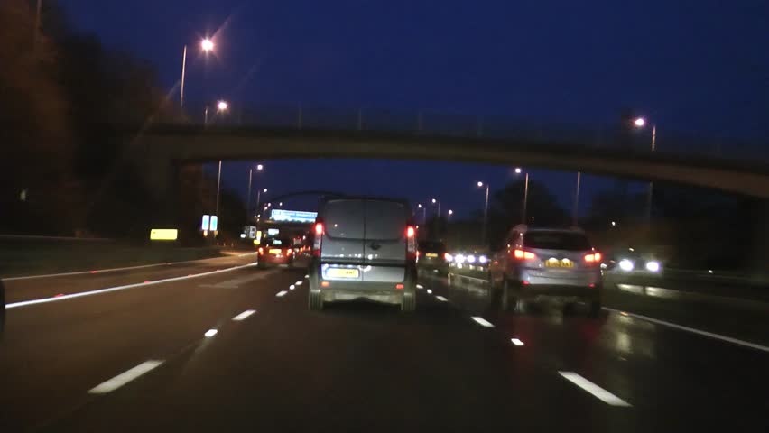 Congestion POV driving shot of car on motorway highway M42, M6 Midlands at night