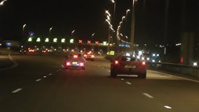 POV driving clip of motorway highway M6 Toll Road Birmingham, Midlands at night as cars approach the toll booth