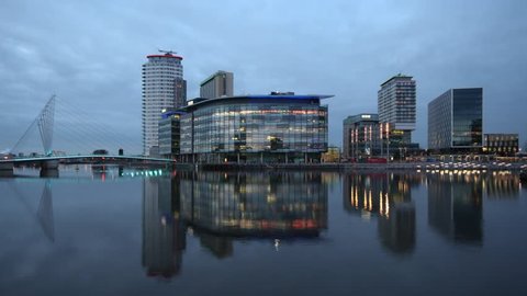 Day to Night Timelapse across the River Irwell of the new BBC buildings at MediaCity, Salford Quays, Manchester