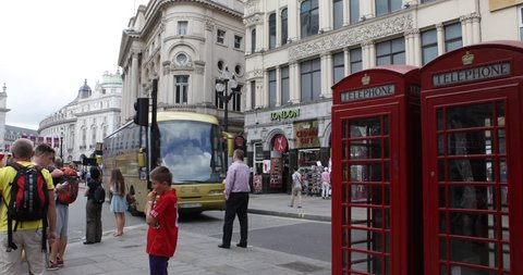 LONDON, UNITED KINGDOM - JULY 30, 2013 London Piccadilly Circus Phonebox British Red Telephone Box City Traffic People Commuters ( Ultra High Definition, Ultra HD, UHD, 4K, 2160P, 4096x2160 )