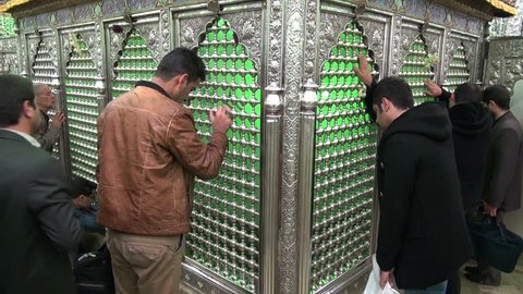 TEHRAN, IRAN - 11 NOVEMBER 2013: Men are mourning at a shrine, during the Muharram period, in Tehran, Iran