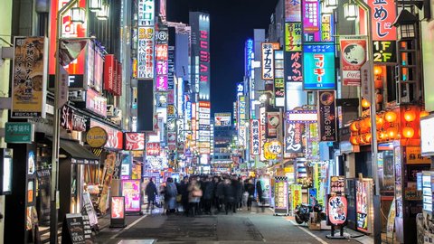TOKYO 2013 - Panning nighttime time lapse of people walking through the Kabukicho area of Shinjuku in Tokyo, Japan (Camera slowly panning out)