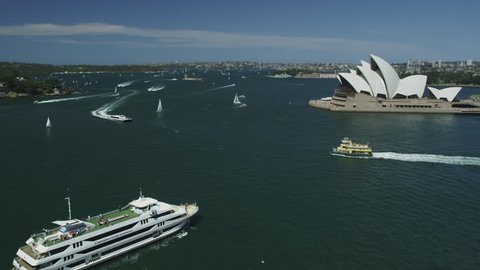 SYDNEY, AUSTRALIA - OCT 2009: The Opera House with Ferry Boats passing