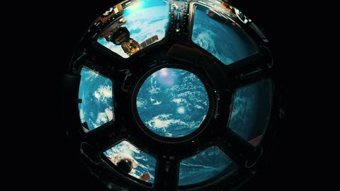 Astronaut waves to other astronauts through space station window., videoclip de stoc
