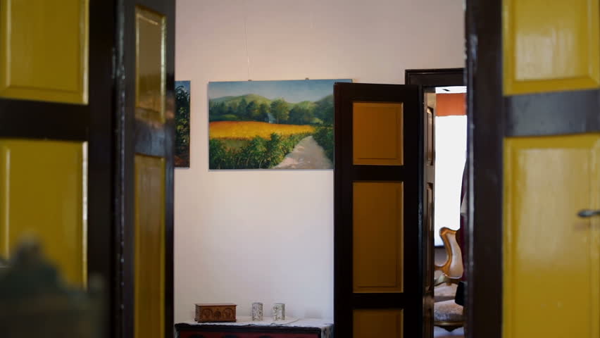 Old 19th century scholar entering the room