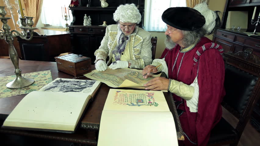 Mayor and scholar talking about an old map figuring out where to go