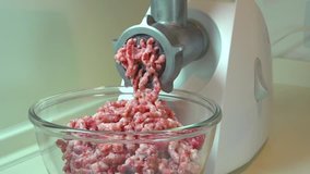 Electric Meat Grinder. Mince. Action of Mincer Machine with fresh Minced meat. Cooking. 1080p HD Video Footage
