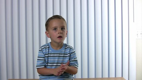 Boy uses his fingers and counts to ten