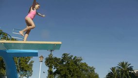 Girl Jumping from springboard and diving in Swimming Pool -Slow Motion-
For videos about: swimming, pools, summer fun, vacation, getaways, underwater footage, kids, beating the heat, and exercise.