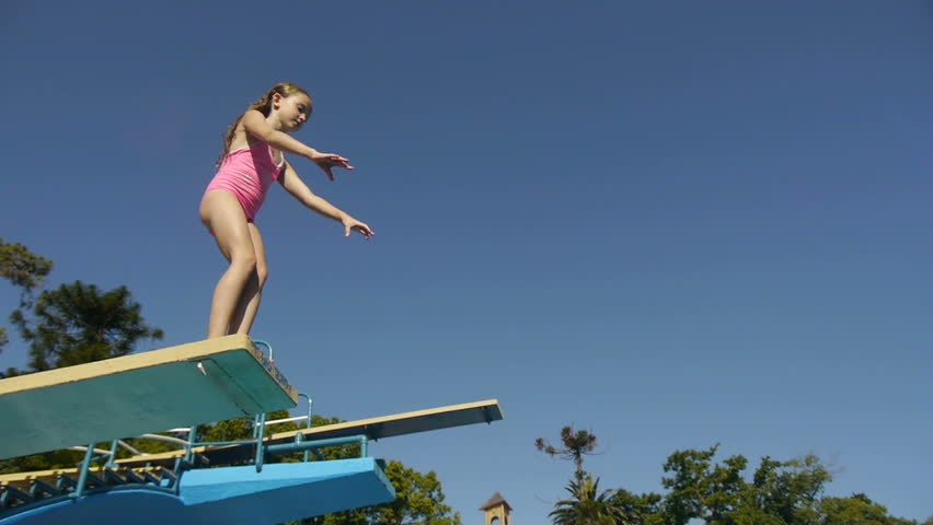 Girl jumping from springboard and diving in Swimming Pool -Slow Motion-
For videos about: swimming, pools, summer fun, vacation, getaways, underwater footage, kids, beating the heat, and exercise. Royalty-Free Stock Footage #5362190