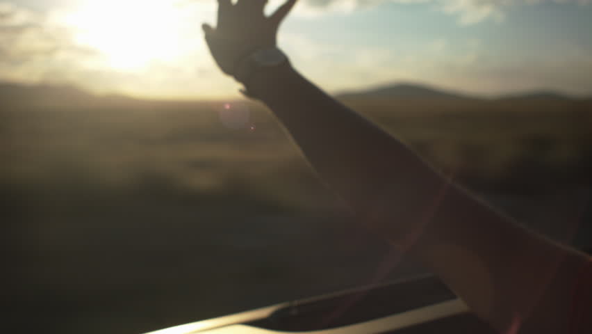 Teen Waves Her Hand In The Wind In A Convertible Royalty-Free Stock Footage #5364641