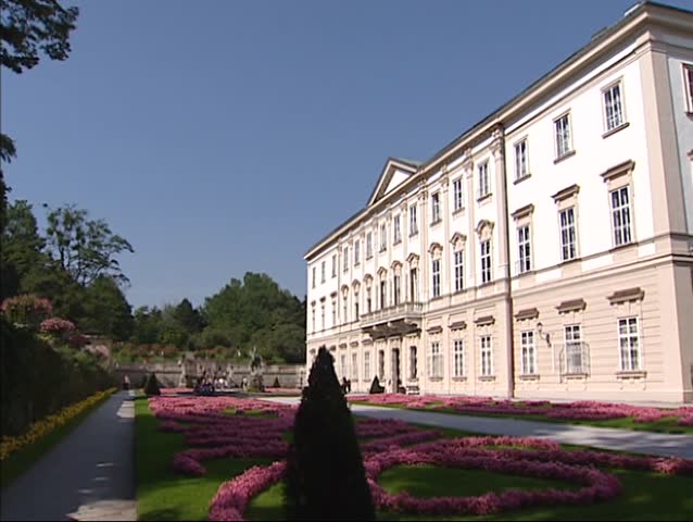 SALZBURG, AUSTRIA - Mirabell Palace or Schloss Mirabell + garden - pan. The Palace and gardens are part of the Historic Centre of the City of Salzburg UNESCO World Heritage Site.