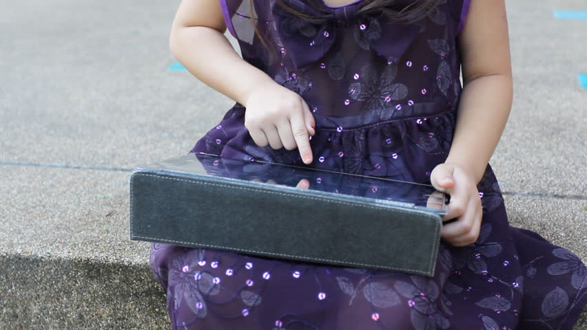 girl play digital tablet