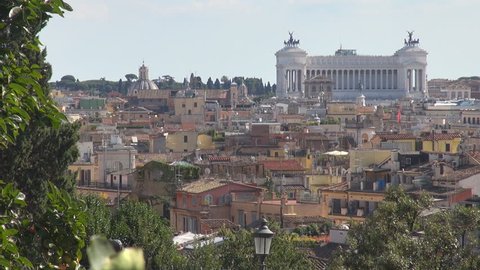Pan right, aerial view of Rome city with National Monument Victor Emmanuel II by day
