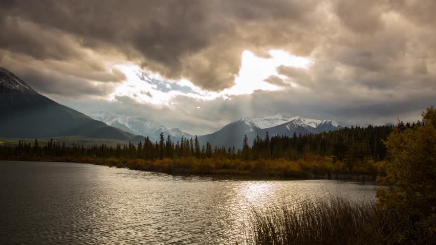 Time Lapse shot of Cloudy day at Vermillion lake with light rays in Banff National Park