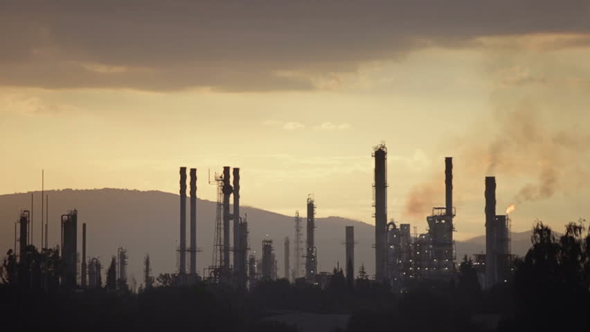 Silhouette of petrochemical refinery industry at sunset | Shutterstock HD Video #5386595