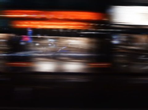 NTSC - Night lights streak as we travel down a city street (Loop).