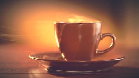 Cup of Hot Coffee Espresso. Coffee or Tea. Brown Cup of hot beverage with Steam. Espresso Coffee closeup. HD video Footage