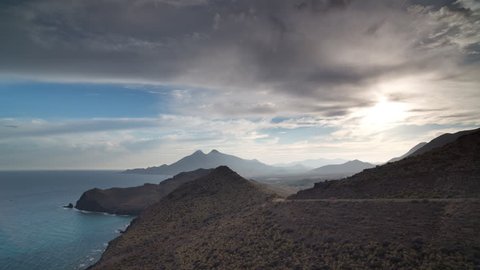 4k Time lapse looking out to sea with mountains in the background on a beautiful afternoon in, cabo de gata, spain